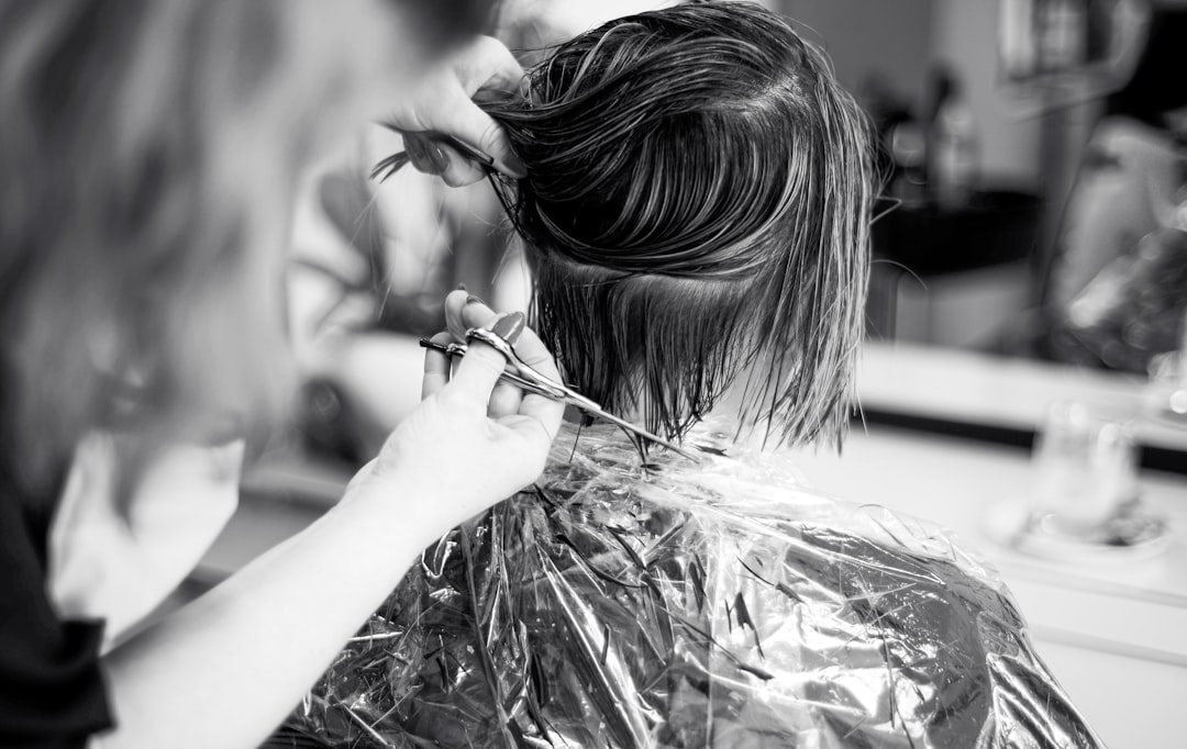 a-woman-cutting-another-womans-hair-in-a-salon-el9o2eemp0k