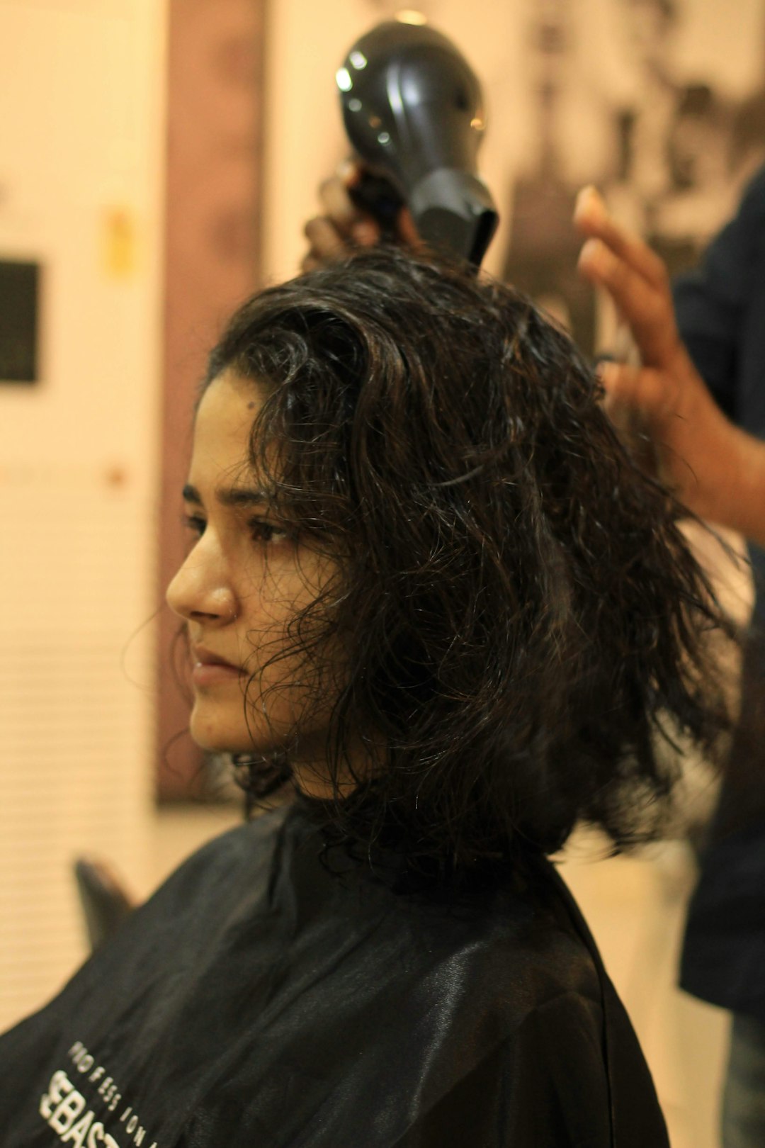 a-woman-getting-her-hair-cut-at-a-salon-jwak7wl0b1s